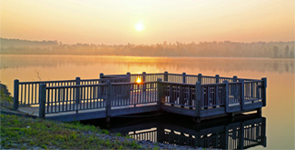 Sunrise from a dock over a placid early morning lake "Troy Douglas" at McLendon Hills