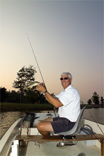 One of our residents aboard his boat shows off an early morning catch
