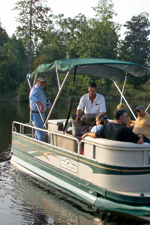 A group of McLendon Hills residents enjoys an afternoon cruise around lake "Troy Douglas"